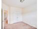 Empty bedroom featuring carpet, neutral walls, and a double door closet at 6227 Castlecove Rd, Charlotte, NC 28278