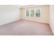 Large bedroom featuring bright windows that let in natural light at 6227 Castlecove Rd, Charlotte, NC 28278