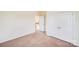 An open bedroom featuring a closet and doorway leading out of the room at 6227 Castlecove Rd, Charlotte, NC 28278