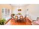 Cozy dining area with hardwood floors and a chandelier, perfect for Gathering meals at 6227 Castlecove Rd, Charlotte, NC 28278