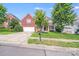 Attractive brick home with a two-car garage and a welcoming front lawn in a residential neighborhood at 6227 Castlecove Rd, Charlotte, NC 28278