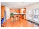 Open kitchen with a center island, wooden cabinets, and stainless steel appliances at 6227 Castlecove Rd, Charlotte, NC 28278