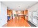 Open kitchen with a center island, wooden cabinets, and stainless steel appliances at 6227 Castlecove Rd, Charlotte, NC 28278