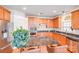 Open kitchen featuring wood cabinets, stainless appliances, and granite countertops at 6227 Castlecove Rd, Charlotte, NC 28278