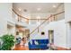 Spacious living room with wood floors and a staircase leading to the second floor at 6227 Castlecove Rd, Charlotte, NC 28278