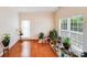 Sun-filled living room boasting hardwood floors, ample natural light, and a cozy atmosphere at 6227 Castlecove Rd, Charlotte, NC 28278