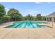 Inviting community pool with clear blue water, surrounded by lounge chairs and lush landscaping for relaxation and enjoyment at 6227 Castlecove Rd, Charlotte, NC 28278
