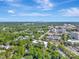 Scenic aerial view of a cityscape featuring tree-lined streets and multiple buildings at 6312 Mission Pl, Charlotte, NC 28210