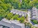 Aerial view of a community with townhomes, trees and green space at 6312 Mission Pl, Charlotte, NC 28210