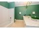 Bathroom with tiled shower and vanity with double sinks at 6312 Mission Pl, Charlotte, NC 28210