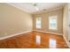 Bedroom with hardwood floors and neutral walls at 6312 Mission Pl, Charlotte, NC 28210