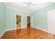 Bright bedroom with ensuite access and hardwood floors at 6312 Mission Pl, Charlotte, NC 28210