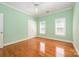 Cozy bedroom with natural light, hardwood flooring and ceiling fan at 6312 Mission Pl, Charlotte, NC 28210