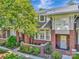 Brick townhome with cozy patios, mature trees, and meticulously landscaped grounds at 6312 Mission Pl, Charlotte, NC 28210