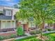 Charming brick townhome featuring a manicured lawn, cozy patios, and beautiful landscaping at 6312 Mission Pl, Charlotte, NC 28210
