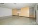 Spacious garage with ample storage space provided by the light wood cabinets and work area at 6312 Mission Pl, Charlotte, NC 28210