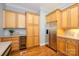 Elegant kitchen featuring custom cabinets, built-in wine fridge, and stainless steel refrigerator at 6312 Mission Pl, Charlotte, NC 28210