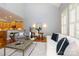 Stylish living room with open floor plan, hardwood floors, and a view of the adjacent kitchen at 6312 Mission Pl, Charlotte, NC 28210
