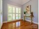 Bright living room with hardwood floors and plantation shutters at 6312 Mission Pl, Charlotte, NC 28210