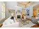 Spacious living room with fireplace, hardwood floors, and view of upstairs landing at 6312 Mission Pl, Charlotte, NC 28210