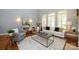 Open-concept living room featuring hardwood floors, a neutral color scheme, and abundant natural light at 6312 Mission Pl, Charlotte, NC 28210