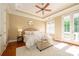 Bright main bedroom boasts natural light, tray ceiling, and plush carpeting at 6312 Mission Pl, Charlotte, NC 28210
