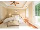 Bright main bedroom boasts natural light, tray ceiling, and plush carpeting at 6312 Mission Pl, Charlotte, NC 28210