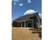 A two-story home with a patio and backyard ready for entertainment, enjoying the weather at 910 Westminster Dr, Statesville, NC 28677