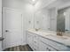 Bright bathroom with double sinks, white cabinets, and walk-in shower at 910 Westminster Dr, Statesville, NC 28677