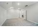 Upstairs bedroom features carpet and offers lots of natural light at 910 Westminster Dr, Statesville, NC 28677