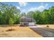 Charming two-story home features a blue exterior, attached garage, and a well-manicured lawn at 910 Westminster Dr, Statesville, NC 28677