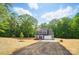 Beautiful home with a long driveway, lush greenery, and a well-maintained lawn at 910 Westminster Dr, Statesville, NC 28677