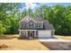 Charming two-story home features a blue exterior, attached garage, and a well-manicured lawn at 910 Westminster Dr, Statesville, NC 28677