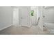 Bright hallway features neutral walls, gray carpet, white doors and trim, and a staircase with a modern railing at 910 Westminster Dr, Statesville, NC 28677