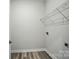 Functional laundry room includes a wire shelf for storage at 910 Westminster Dr, Statesville, NC 28677
