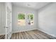 Bright office with hardwood floors, windows, and glass door entry at 910 Westminster Dr, Statesville, NC 28677