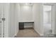 A carpeted office nook features a built in desk, storage drawers, and overhead lighting at 910 Westminster Dr, Statesville, NC 28677