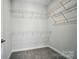 Walk-in closet with carpet and wire shelving ready to store all of your belongings at 910 Westminster Dr, Statesville, NC 28677