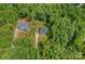Expansive aerial view of home and adjacent lot, surrounded by lush trees and landscaping at 9564 Regent Dr, Davidson, NC 28036