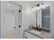 Modern bathroom featuring a gray countertop, black hardware, and stylish lighting fixture at 9564 Regent Dr, Davidson, NC 28036