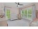 Charming Bedroom with soft pink walls, a white crib, and a cozy rocking chair at 9564 Regent Dr, Davidson, NC 28036