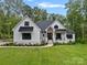 Beautiful home featuring a well-manicured lawn and landscaping at 9564 Regent Dr, Davidson, NC 28036