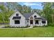 Charming two-story home with a manicured lawn and elegant landscaping at 9564 Regent Dr, Davidson, NC 28036