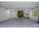 Finished garage featuring exercise equipment with lots of natural light at 9564 Regent Dr, Davidson, NC 28036