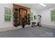 Finished garage featuring an organized home gym setup and bright windows at 9564 Regent Dr, Davidson, NC 28036