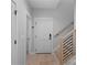 Welcoming hallway with wood floors, staircase, and neutral paint at 9564 Regent Dr, Davidson, NC 28036