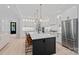Bright kitchen featuring stainless steel appliances, a central island with seating at 9564 Regent Dr, Davidson, NC 28036