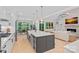 Open-concept kitchen with a large island, modern appliances, and a view of the living area at 9564 Regent Dr, Davidson, NC 28036