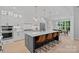 Spacious kitchen featuring a large center island with seating and stainless appliances at 9564 Regent Dr, Davidson, NC 28036