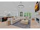 Open-concept living room flows into the kitchen, featuring a fireplace and plenty of natural light at 9564 Regent Dr, Davidson, NC 28036